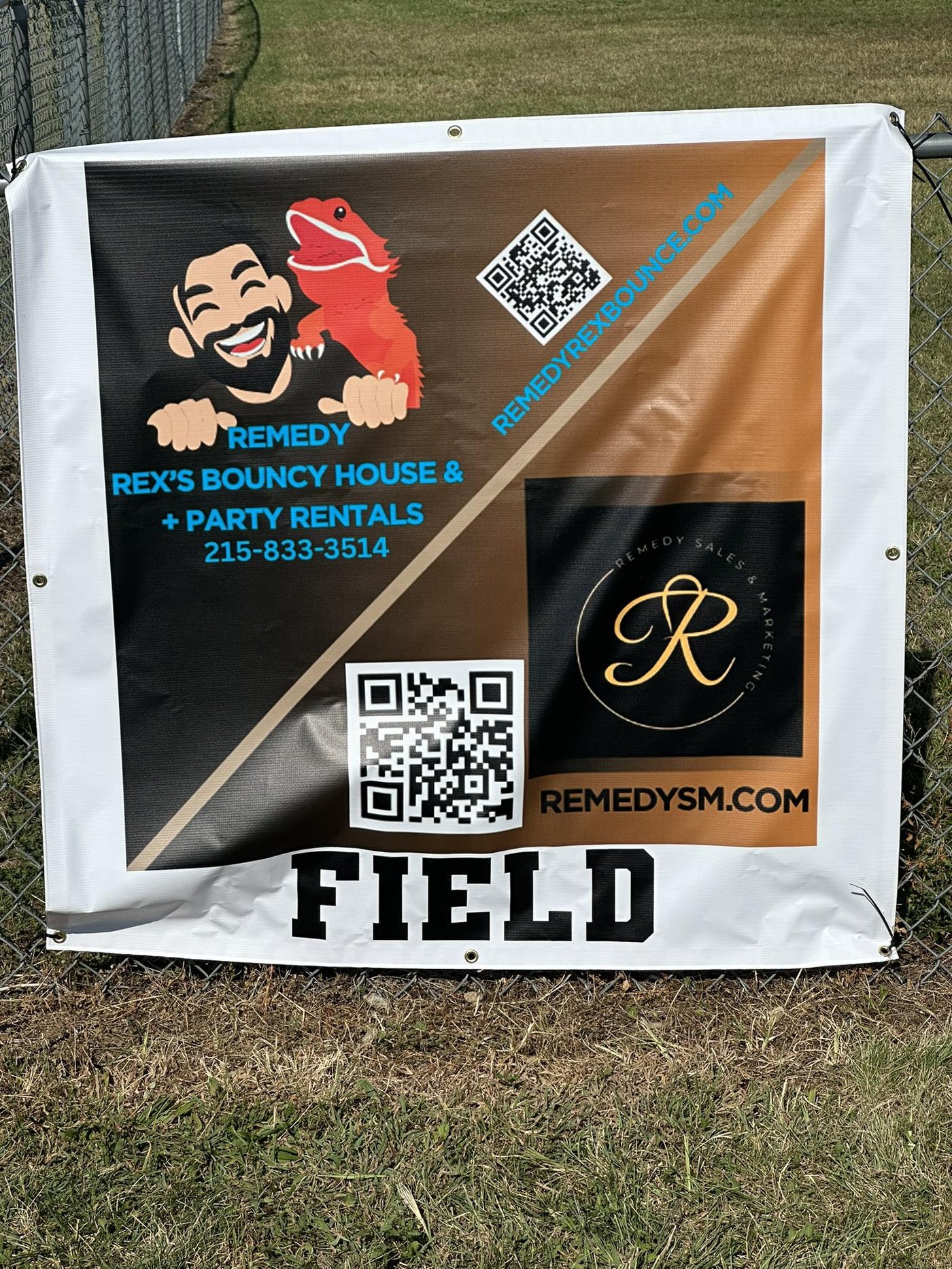 Remedy Rex's sponsorship banner at a local field